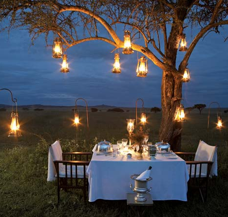 If you're having an outdoor wedding in the evening consider using hanging 